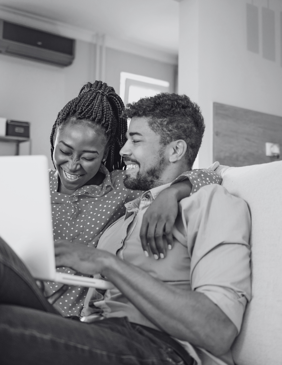 A foreign national and British partner reviewing mortgage documents together.